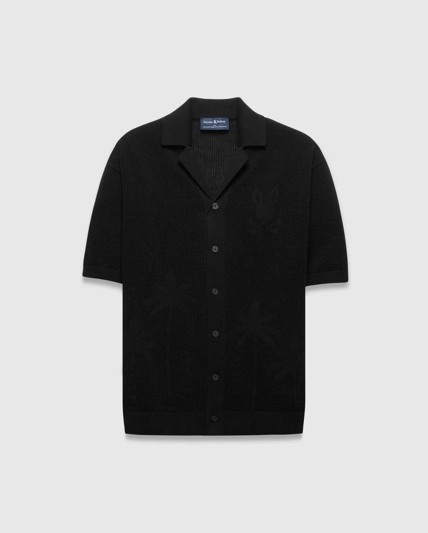 Mens Brad Oversized Knit Shirt in black, featuring a textured knit fabric, a subtle tone-on-tone Psycho Bunny skull logo on the left chest, and knit palm tree patterns.