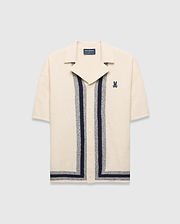 Mens Giles Relaxed Fit Border Knit Shirt in cream textured knit, featuring navy and heather grey vertical stripes, a spread collar, and a small embroidered Psycho Bunny skull on the left chest.