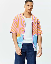 Mens Ray Relaxed Fit Jacquard Shirt with a vibrant pink and orange striped sunburst, blue and light blue wave pattern, and small embroidered Psycho Bunny skull logo on the left chest.