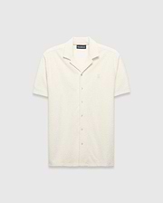 Mens Tristan Shirt, an ecru short-sleeve camp collar shirt in textured terry fabric with an all-over diamond pattern and a small embroidered Psycho Bunny logo on the left chest.