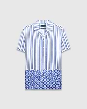 Mens Brad Tencel Shirt, a relaxed fit white and blue striped short-sleeve button-up with a unique Psycho Bunny skull and palm tree pattern along the hem.