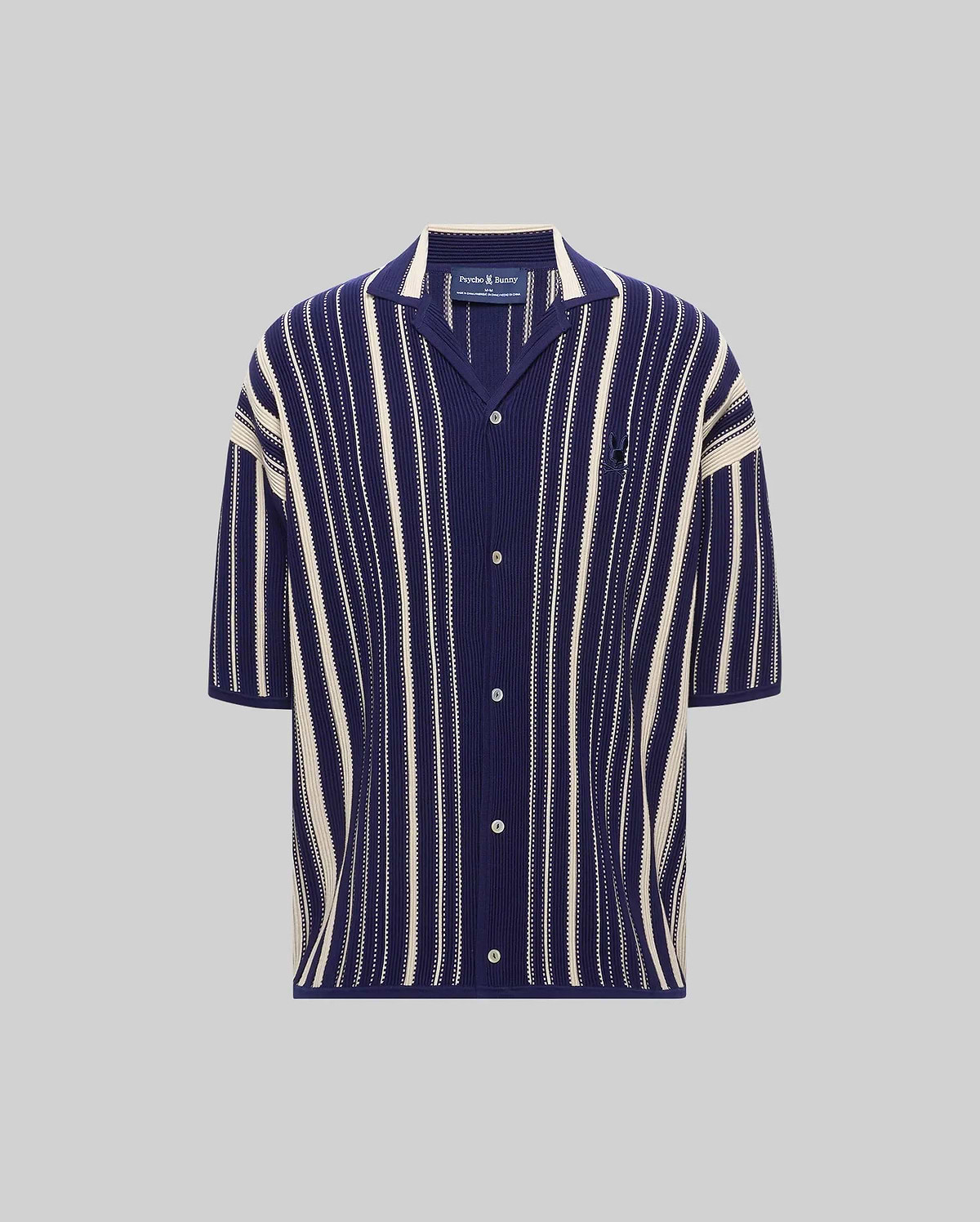 MENS CLIFF SHIRT, a relaxed fit navy blue and cream vertical striped ribbed knit short-sleeve shirt with a spread collar, full button placket, and small embroidered Psycho Bunny skull logo on the left chest.