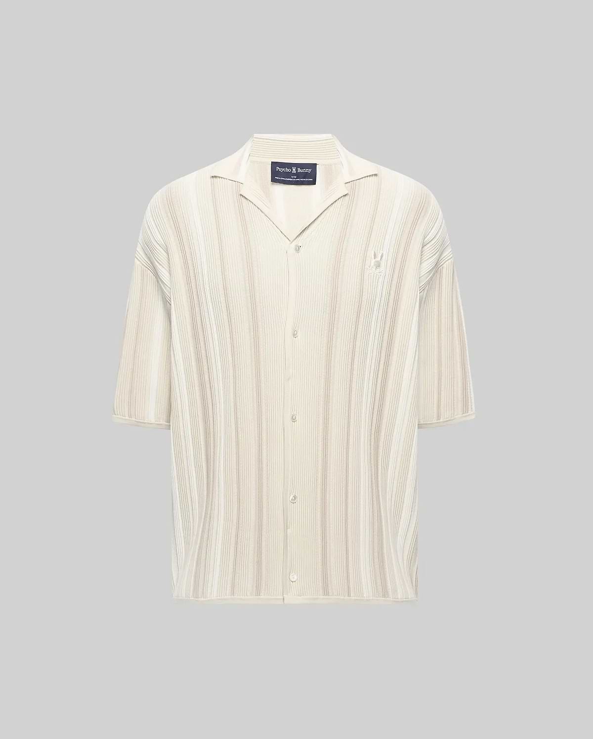 Mens Cliff Shirt, a relaxed fit cream ribbed knit short-sleeve button-up with subtle beige vertical stripes, camp collar, and small embroidered Psycho Bunny skull logo on the left chest.