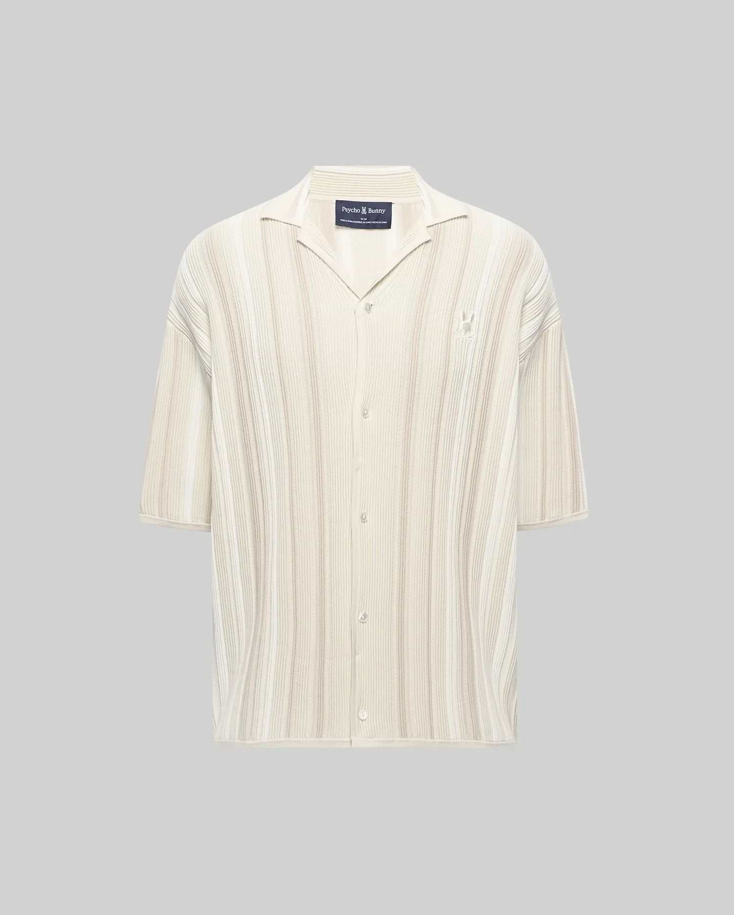 Mens Cliff Shirt, a relaxed fit cream ribbed knit short-sleeve button-up with subtle beige vertical stripes, camp collar, and small embroidered Psycho Bunny skull logo on the left chest.