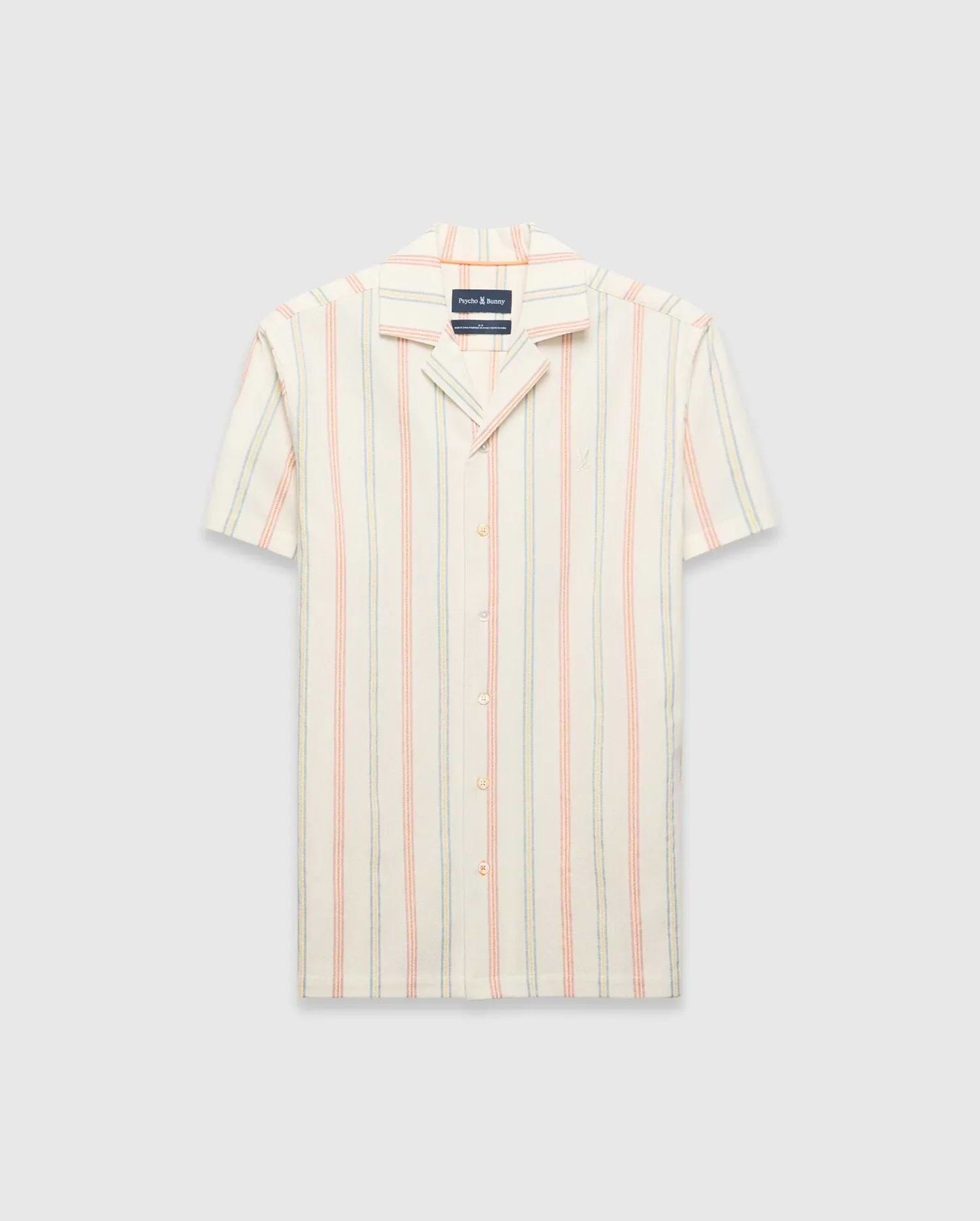 Mens Antoine Shirt: Cream short-sleeve camp collar shirt with vertical thin stripes in light blue, peach, and yellow, featuring a small embroidered Psycho Bunny skull logo on the left chest and a relaxed fit.