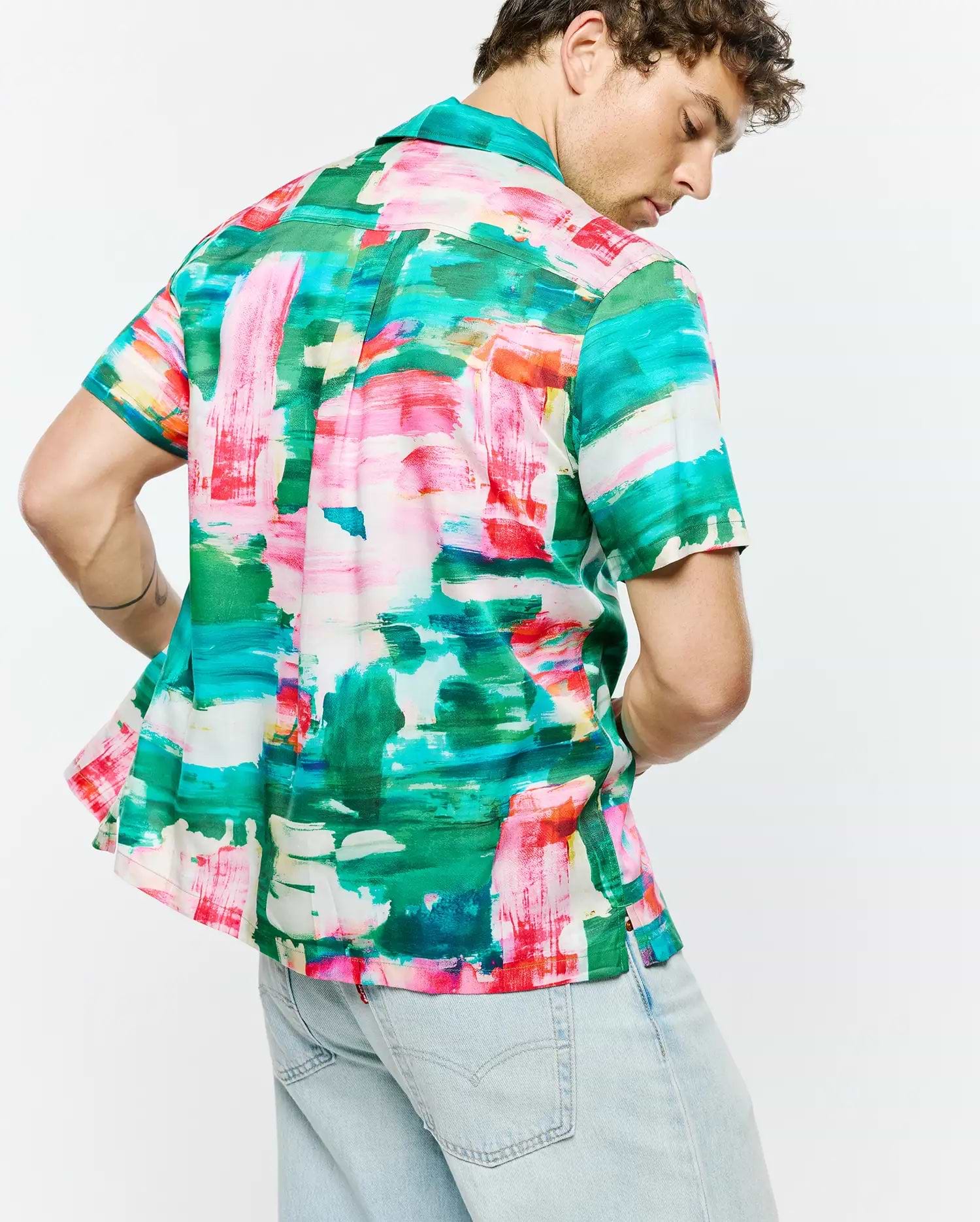 Mens Nate Tencel Shirt, a relaxed fit short-sleeve button-up shirt crafted from smooth Tencel fabric, featuring a vibrant abstract brushstroke print in green, pink, red, blue, and white.