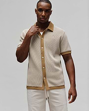 Mens Maxton Waffle Shirt, a classic fit short-sleeve button-up in cream and tan waffle knit, featuring a tan spread collar, full placket, and small embroidered Psycho Bunny skull logo on the left chest.