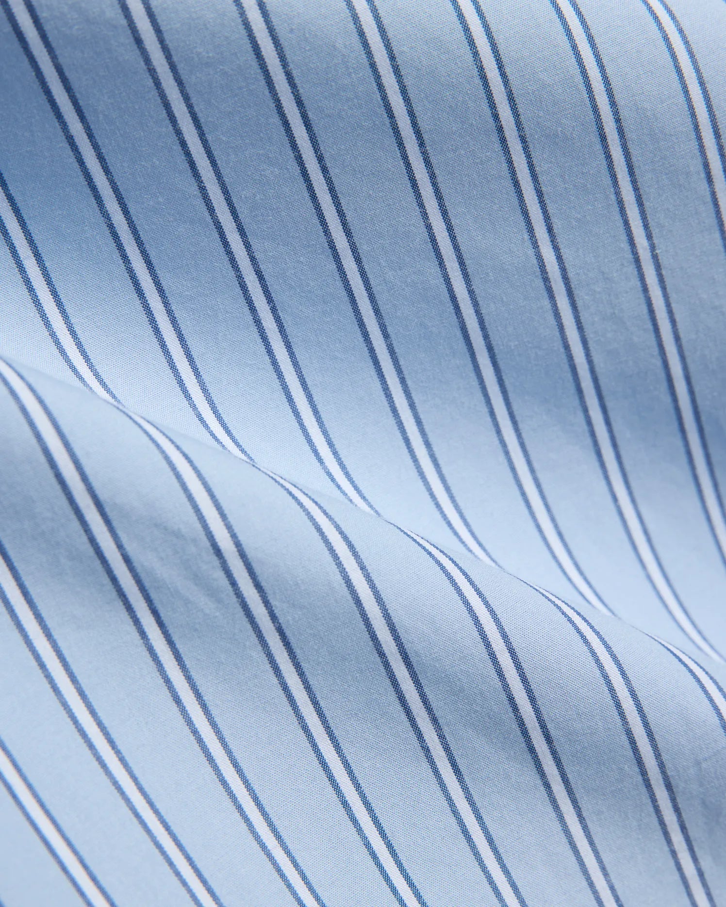Mens Duncan Stripe Shirt, a light blue fine woven fabric with crisp vertical stripes in white and thin dark blue, showcasing a refined classic pattern.