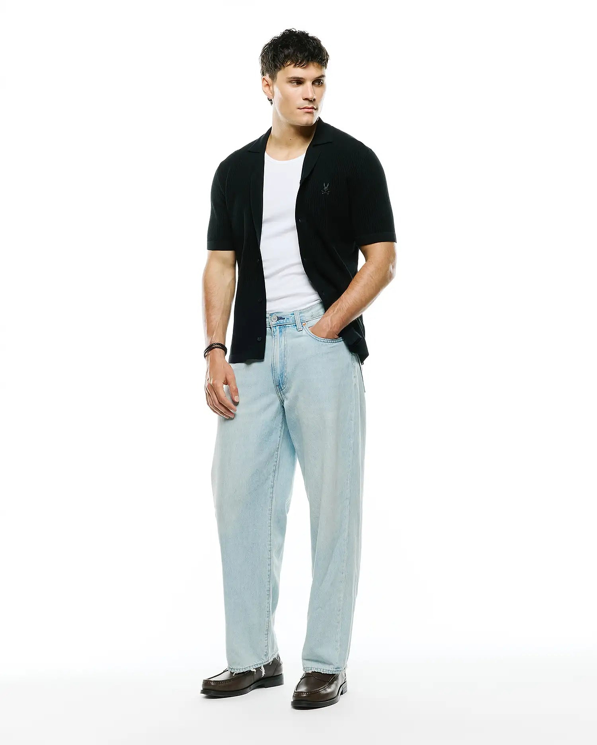 Mens Yann Knit Shirt, black ribbed knit, classic fit, short-sleeve button-front with camp collar and small embroidered Psycho Bunny skull logo on left chest. (4)