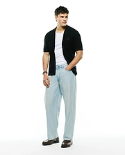 Mens Yann Knit Shirt, black ribbed knit, classic fit, short-sleeve button-front with camp collar and small embroidered Psycho Bunny skull logo on left chest. (4)