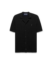 Black Mens Yann Knit Shirt with a classic fit, featuring a ribbed knit texture, full button-front, spread collar, short sleeves, and a small embroidered Psycho Bunny skull logo on the left chest. (5)