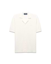 Mens Yann Knit Shirt, cream ribbed knit, short-sleeve, full button-front, camp collar, with a small embroidered Psycho Bunny skull logo on the left chest, classic fit. (6)
