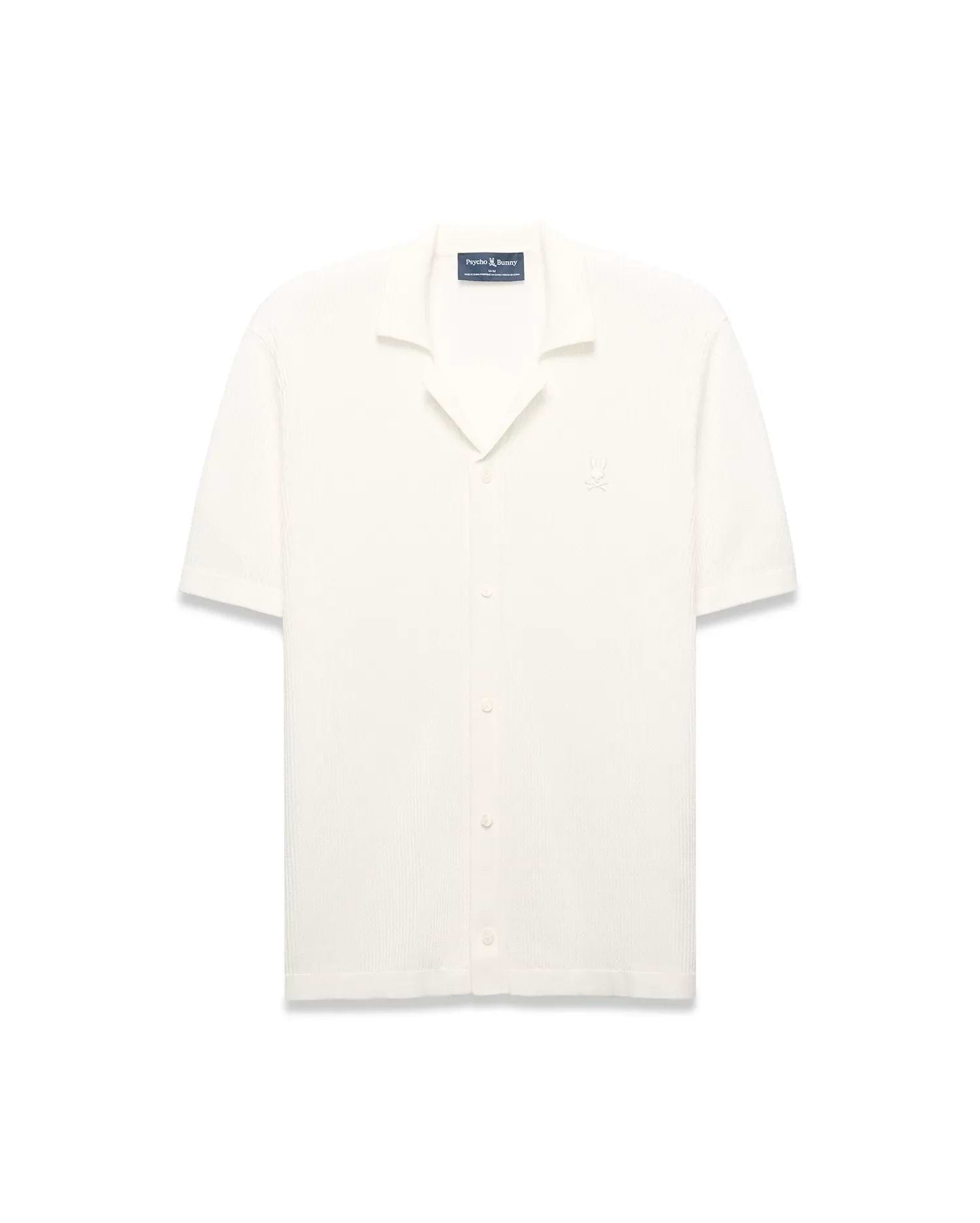 Mens Yann Knit Shirt, cream ribbed knit, short-sleeve, full button-front, camp collar, with a small embroidered Psycho Bunny skull logo on the left chest, classic fit. (6)