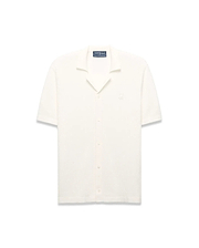 Mens Yann Knit Shirt, cream ribbed knit, short-sleeve, full button-front, camp collar, with a small embroidered Psycho Bunny skull logo on the left chest, classic fit. (6)