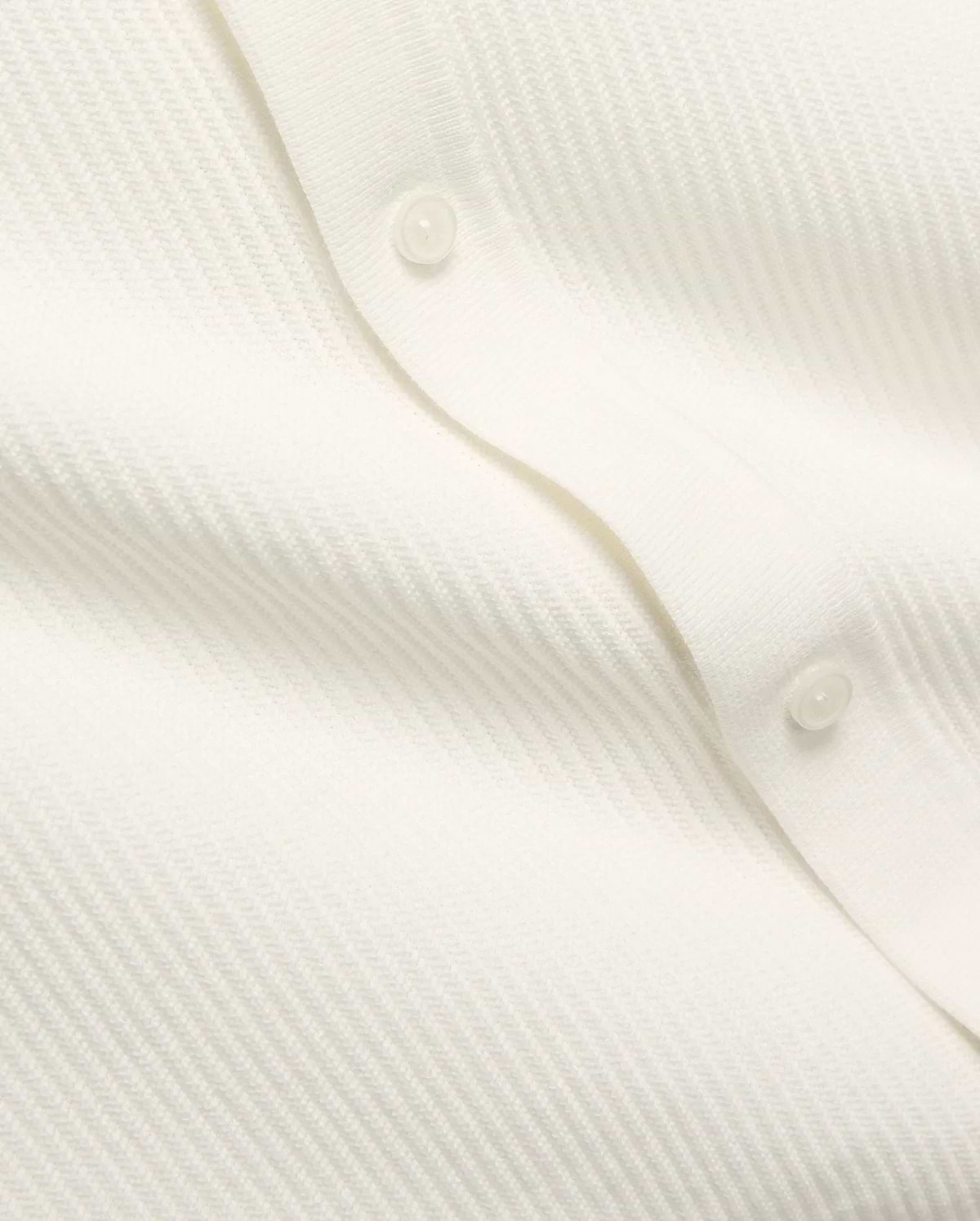 Mens Yann Knit Shirt by Psycho Bunny, a crisp white knit top with a subtle diagonal chevron pattern, featuring a clean button placket with translucent buttons. (7)