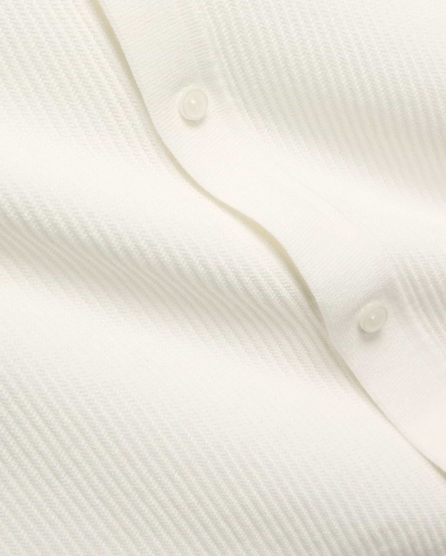 Mens Yann Knit Shirt by Psycho Bunny, a crisp white knit top with a subtle diagonal chevron pattern, featuring a clean button placket with translucent buttons. (7)