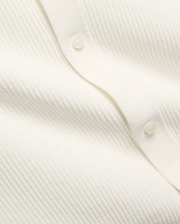 Mens Yann Knit Shirt by Psycho Bunny, a crisp white knit top with a subtle diagonal chevron pattern, featuring a clean button placket with translucent buttons. (7)