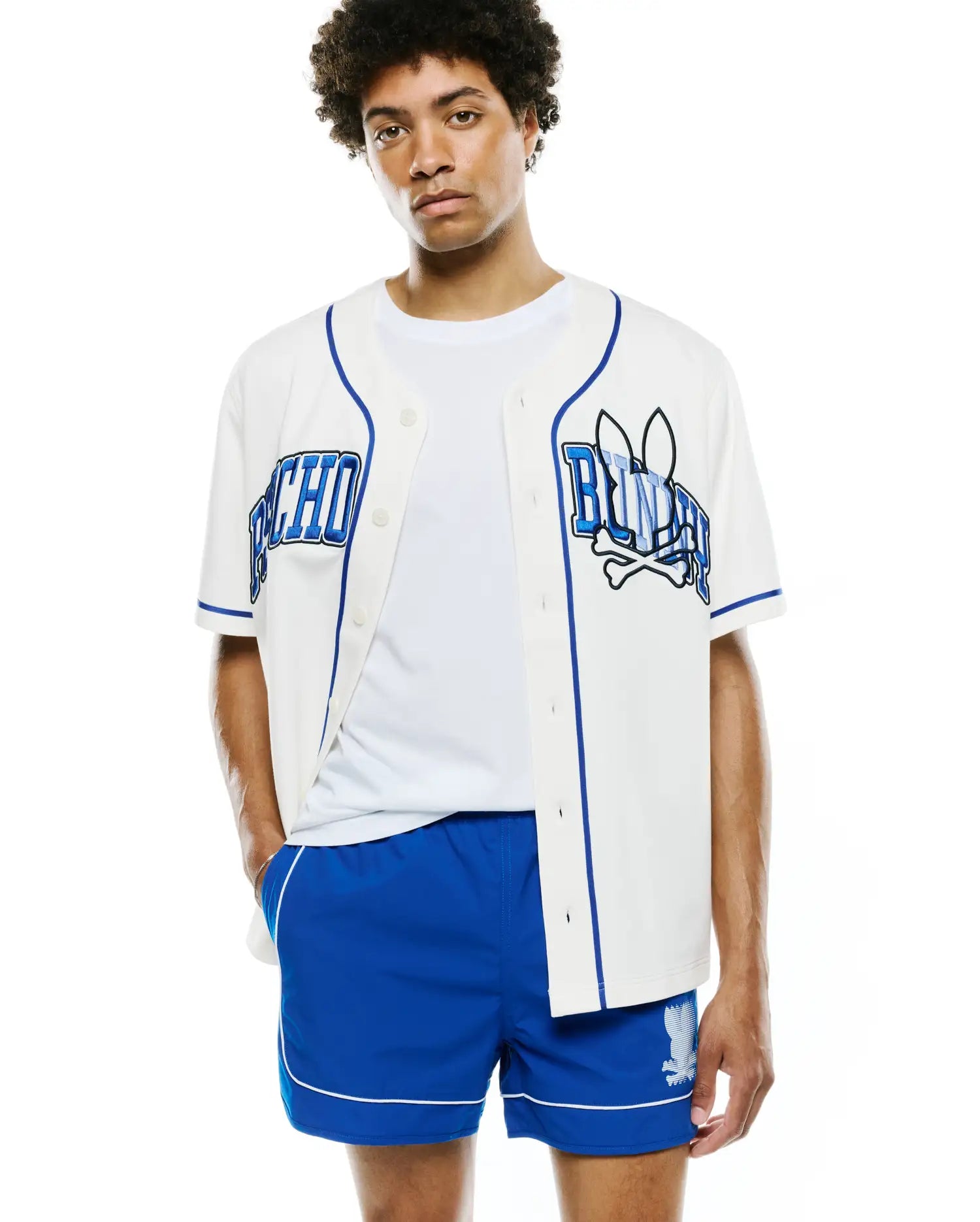 White Mens Nathaniel Baseball Shirt with royal blue piping, featuring a large embroidered PSYCHO on the left chest and BUNNY with the iconic bunny skull and crossbones on the right chest, in a relaxed jersey fit.