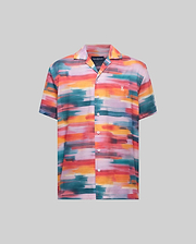 Mens Raphael Tencel Shirt, a vibrant multi-color abstract brushstroke short-sleeve shirt with a camp collar, full button-front, and a small white embroidered Psycho Bunny skull logo on the left chest.