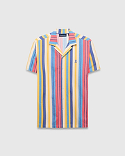 Mens Hubert Knit Shirt, a vibrant striped short-sleeve button-up featuring cream, blue, yellow, and coral vertical stripes, a relaxed fit, and a small embroidered Psycho Bunny skull logo on the left chest.