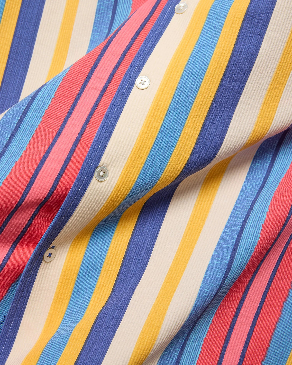 Mens Hubert Knit Shirt, vibrant multi-color vertical stripes in red, pink, blue, yellow, and cream, with a textured knit fabric and white buttons.