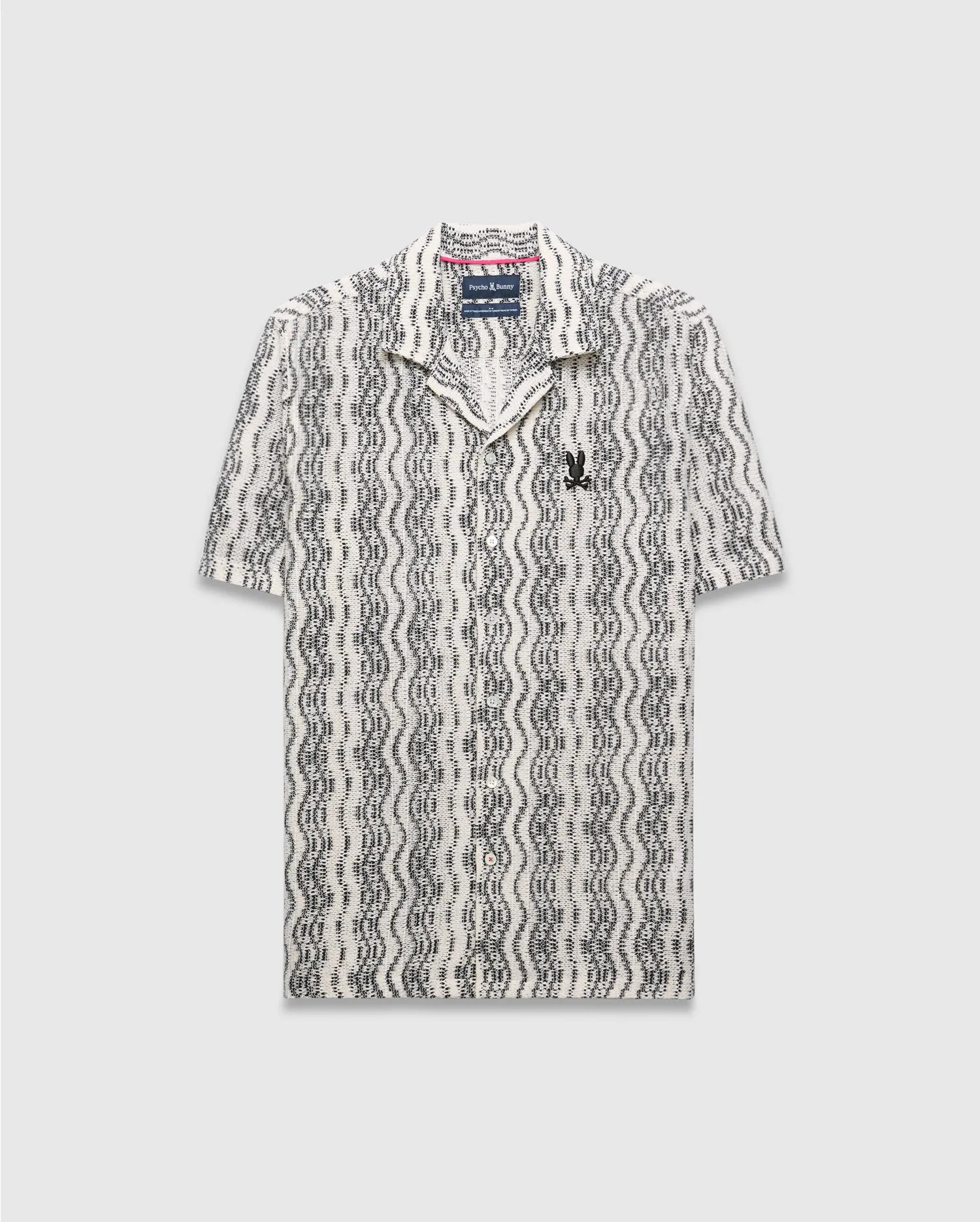 Mens Dave Crochet Shirt: Relaxed fit cream and black wavy stripe crochet knit shirt with a camp collar and small embroidered black Psycho Bunny skull logo on the left chest.