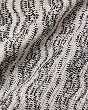 Mens Dave Crochet Shirt featuring an intricate open-weave knit in cream and black, forming a textured striped pattern, with a visible light button closure.