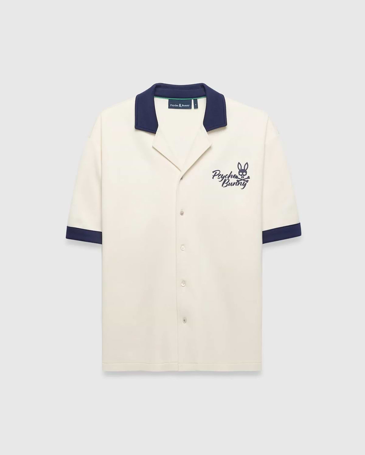 Mens Kelly Oversized Shirt in cream knit, featuring a navy spread collar and sleeve cuffs, with an embroidered navy Psycho Bunny skull logo and script on the left chest.