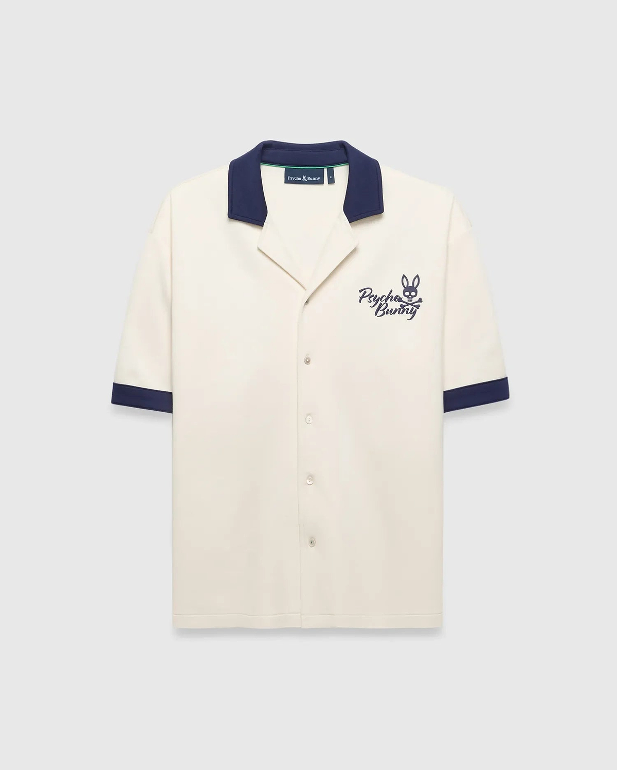 Mens Kelly Oversized Shirt in cream knit, featuring a navy spread collar and sleeve cuffs, with an embroidered navy Psycho Bunny skull logo and script on the left chest.