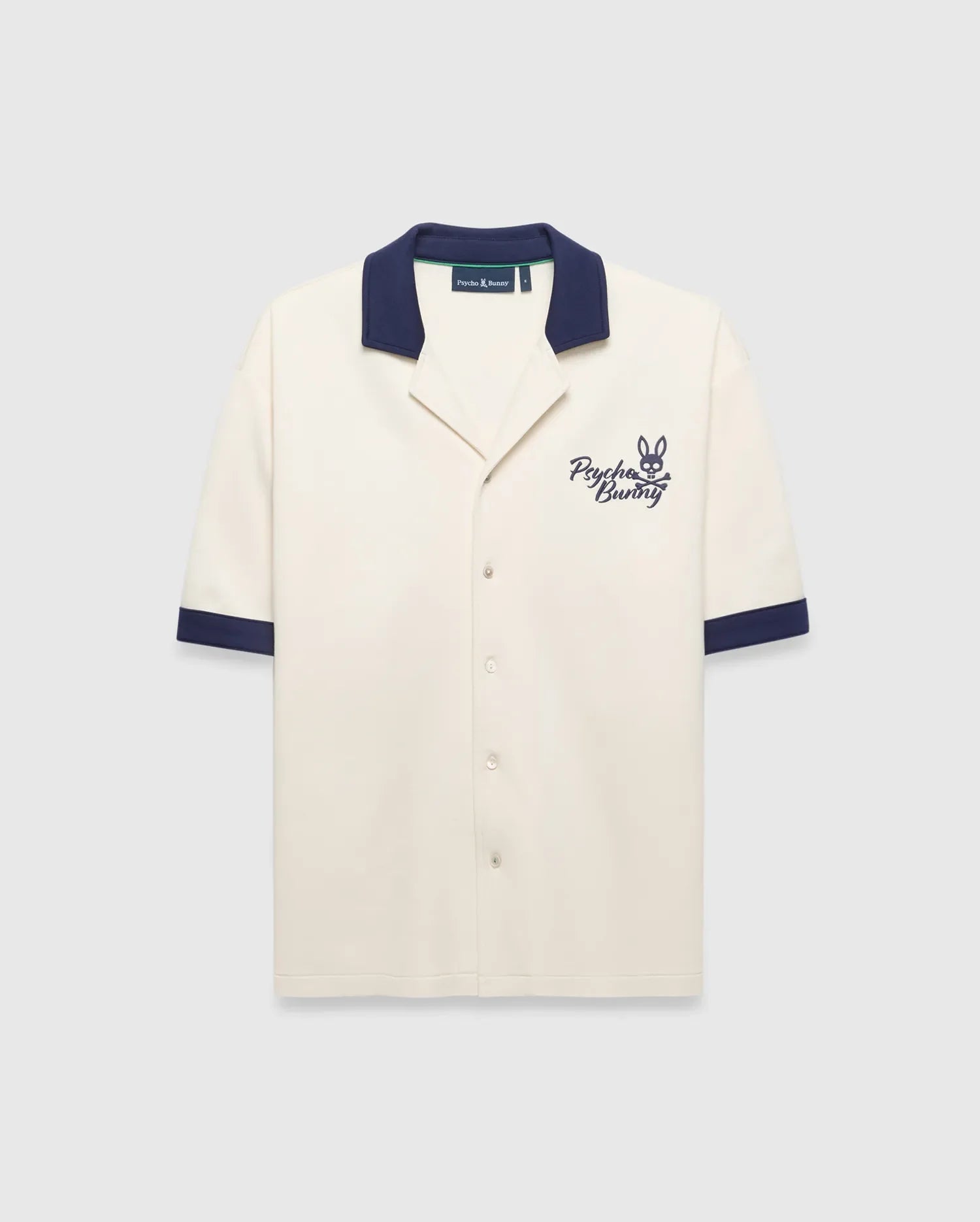 Mens Kelly Oversized Shirt in cream knit, featuring a navy spread collar and sleeve cuffs, with an embroidered navy Psycho Bunny skull logo and script on the left chest.