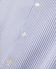 Mens Jim Stripe Jersey Knit L/s Shirt, a premium white long-sleeve shirt featuring fine blue vertical pinstripes and lustrous mother-of-pearl buttons, reflecting refined streetwear aesthetics.