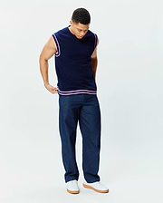 Mens Peter Knit Vest, navy classic fit knit with pink striped ribbed armholes and hem, featuring a small embroidered Psycho Bunny skull logo on the left chest.