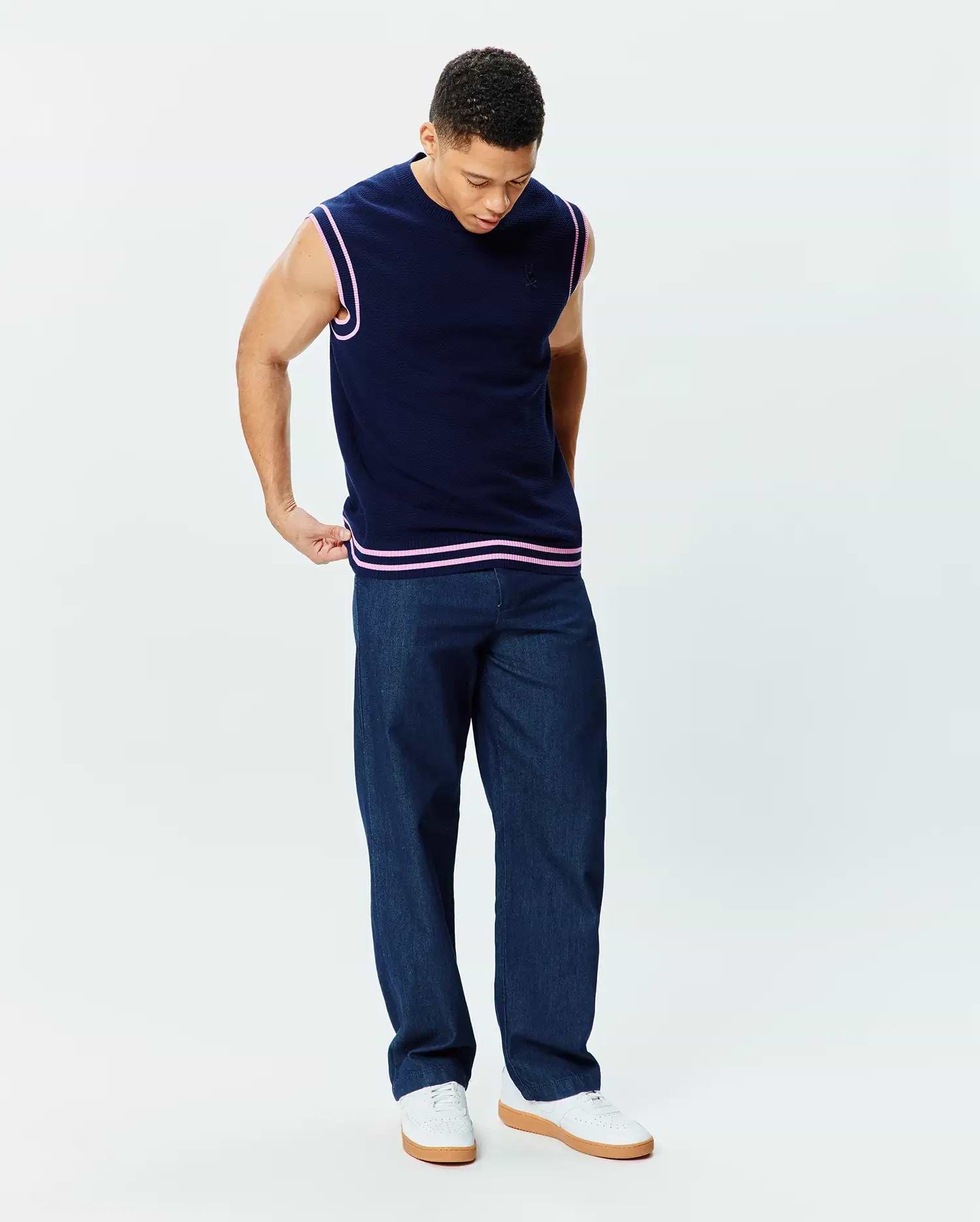 Mens Peter Knit Vest, navy classic fit knit with pink striped ribbed armholes and hem, featuring a small embroidered Psycho Bunny skull logo on the left chest.