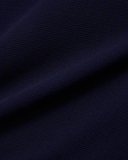 Mens Peter Knit Vest in a rich, dark navy blue, featuring a premium, finely textured knit fabric with a distinct, subtle pique-like weave, offering a sophisticated and breathable feel.