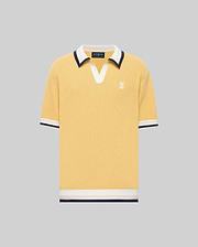 The Psycho Bunny MENS CARTER JOHNNY COLLAR KNIT POLO (MT0400093) is a yellow short-sleeve 100% cotton shirt with a white and navy Johnny collar, chest logo embroidery, and matching sleeve and hem trim, shown on a gray background.