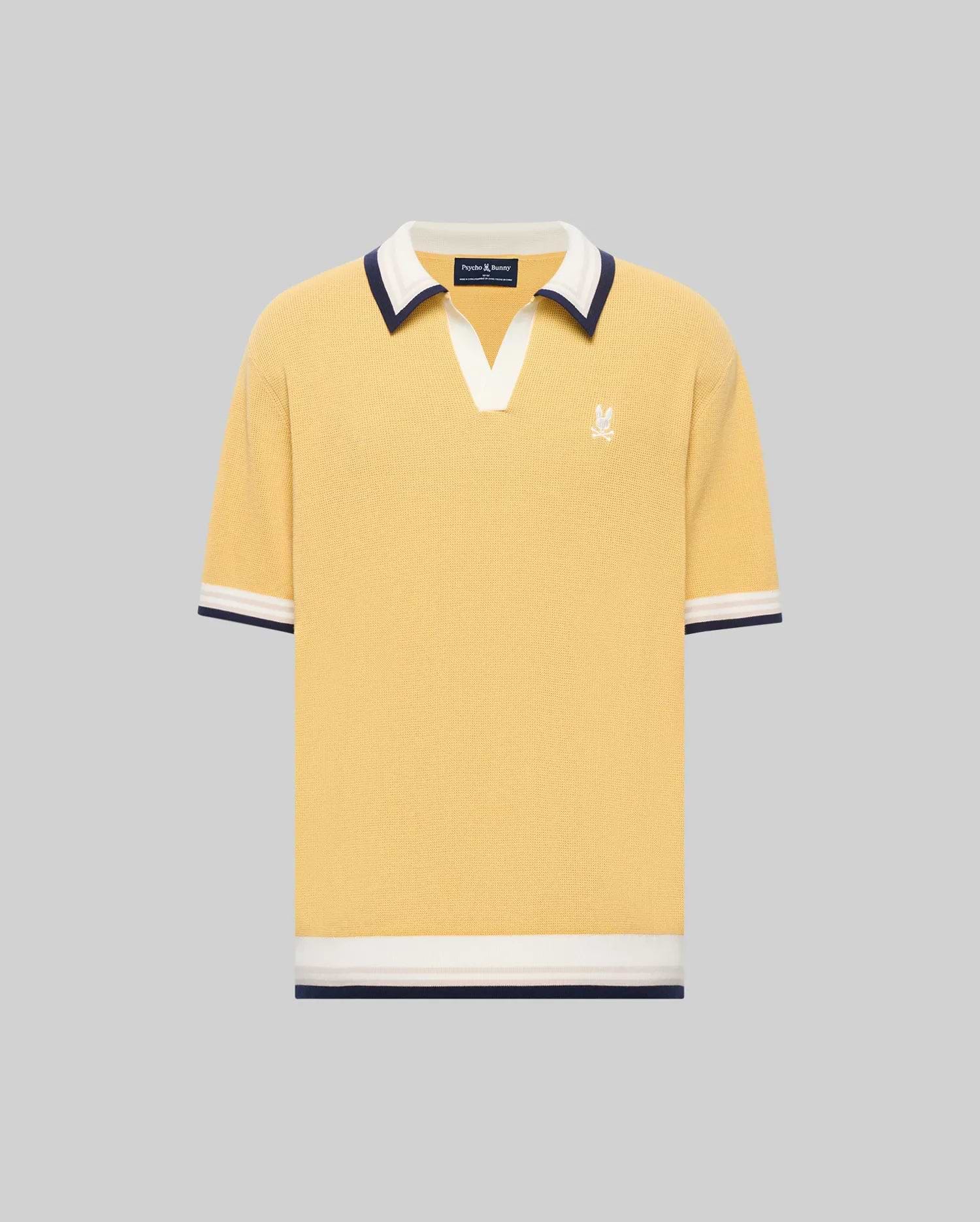 The Psycho Bunny MENS CARTER JOHNNY COLLAR KNIT POLO (MT0400093) is a yellow short-sleeve 100% cotton shirt with a white and navy Johnny collar, chest logo embroidery, and matching sleeve and hem trim, shown on a gray background.