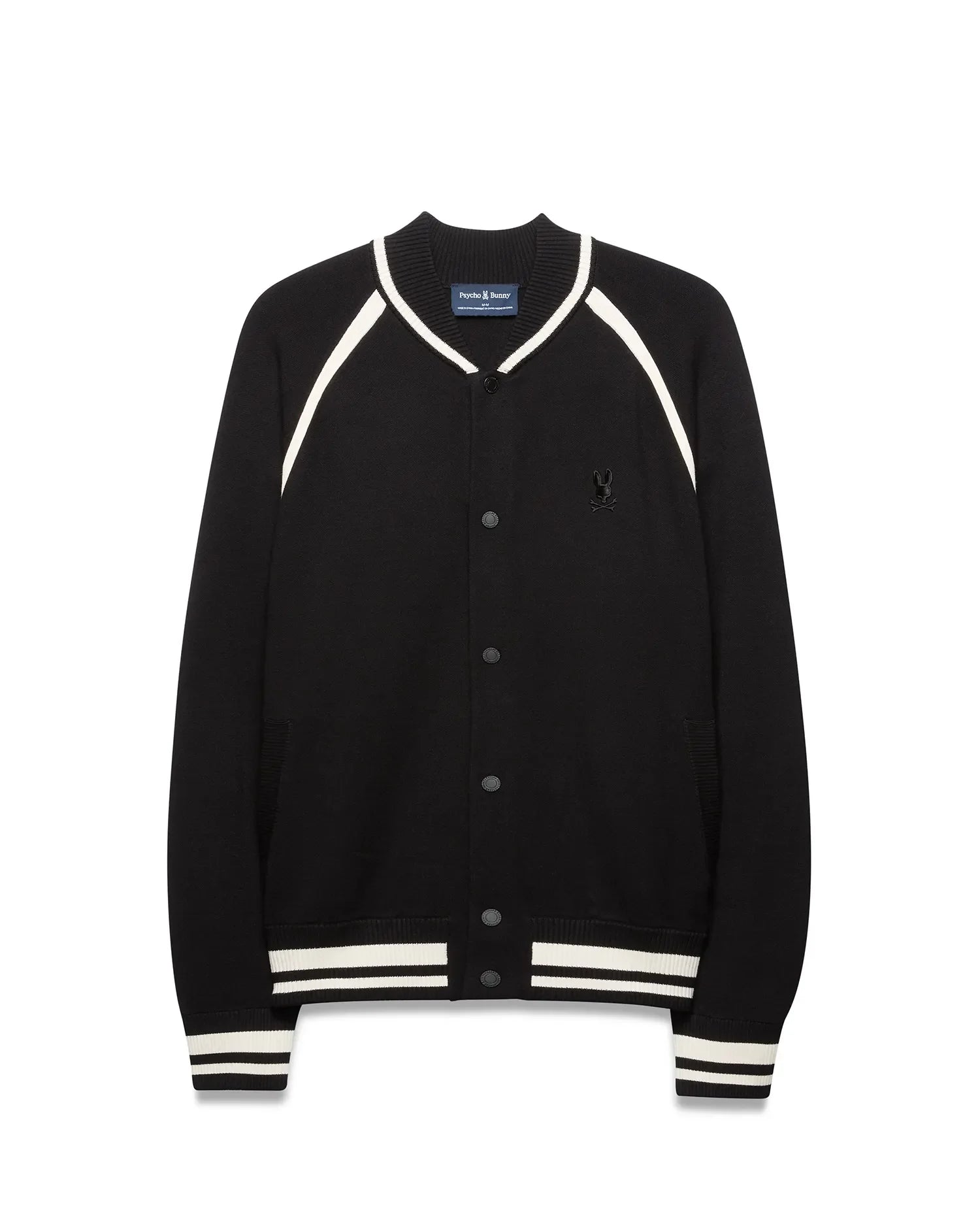 Mens Rafferty Cardigan: Black knit varsity cardigan with white stripe accents on ribbed collar, raglan sleeves, cuffs, and hem, featuring snap buttons and a small embroidered Psycho Bunny skull logo on the left chest. (5)