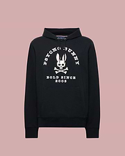 The Psycho Bunny MENS ARCHIVE HOODIE - MT0500009 is a black French terry hoodie with a large white bunny skull and crossbones graphic, “PSYCHO BUNNY” above and “BOLD SINCE 2005” below, plus front pocket and drawstring hood.