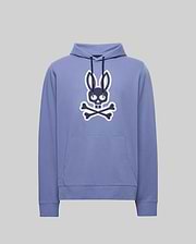 The Psycho Bunny MENS RYDER EMBROIDERED BUNNY PATCH HOODIE - MT0500029 is a light purple hoodie with a front pocket, featuring a large black and white Bunny patch above crossed bones—ideal for cozy loungewear.