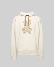 The Psycho Bunny MENS RYDER EMBROIDERED BUNNY PATCH HOODIE (MT0500029) is a cream-colored hoodie with a front pocket, drawstring hood, and large embroidered bunny skull and crossbones patch—ideal for cozy loungewear style.