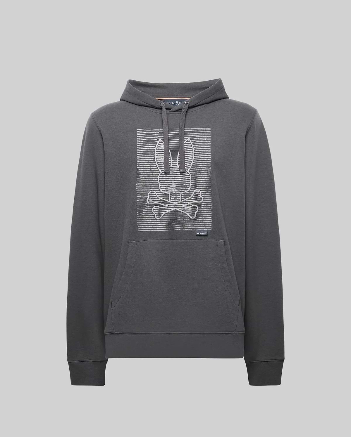 The Psycho Bunny MENS GRANT HOODIE - MT0500032 is a dark gray premium cotton hoodie featuring a front pouch pocket and a bold, digital-inspired bunny skull and crossbones outlined with white horizontal lines on the chest.