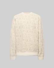 The Psycho Bunny MENS REED FLOCK CREW (MT0500041) is a premium cotton blend cream crewneck pullover, featuring a beige cartoon bunny pattern and "SBX" text on a plain gray background.