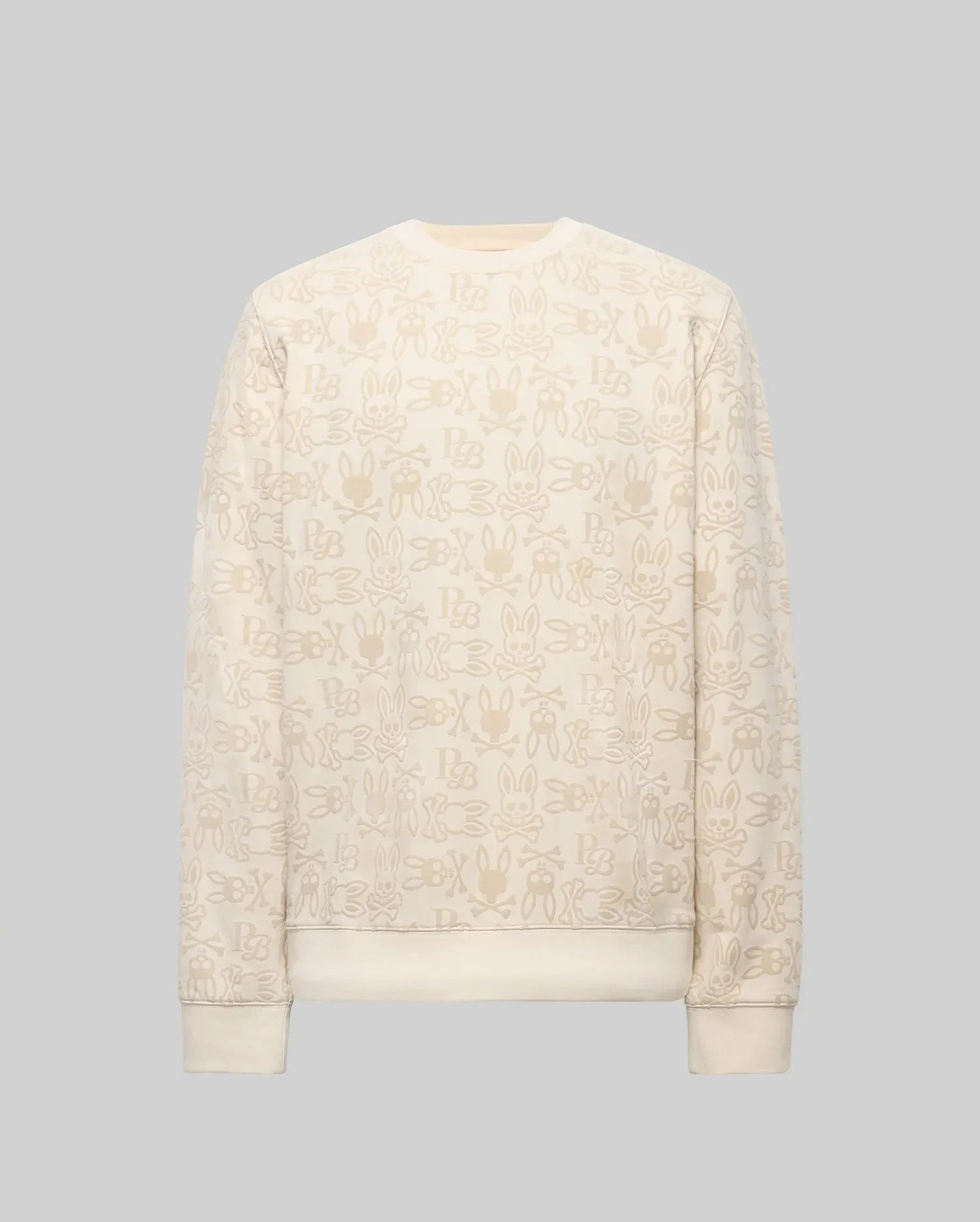 The Psycho Bunny MENS REED FLOCK CREW (MT0500041) is a premium cotton blend cream crewneck pullover, featuring a beige cartoon bunny pattern and "SBX" text on a plain gray background.