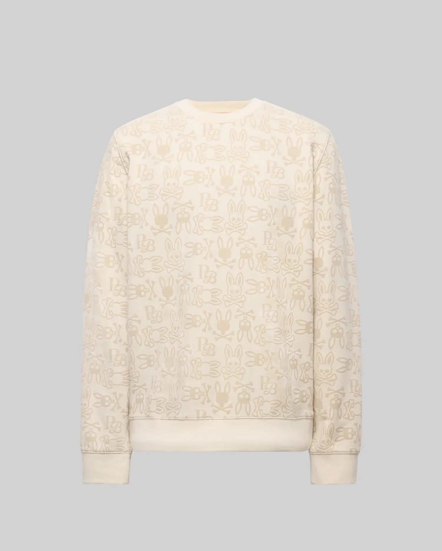 The Psycho Bunny MENS REED FLOCK CREW (MT0500041) is a premium cotton blend cream crewneck pullover, featuring a beige cartoon bunny pattern and "SBX" text on a plain gray background.