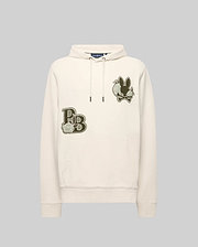The Psycho Bunny MENS AUGUSTE HOODIE (MT0500043) is a cream regular-fit cotton hoodie with a front pocket, olive green chest patches, stylized lettering, and a chenille floral-detailed bunny graphic.