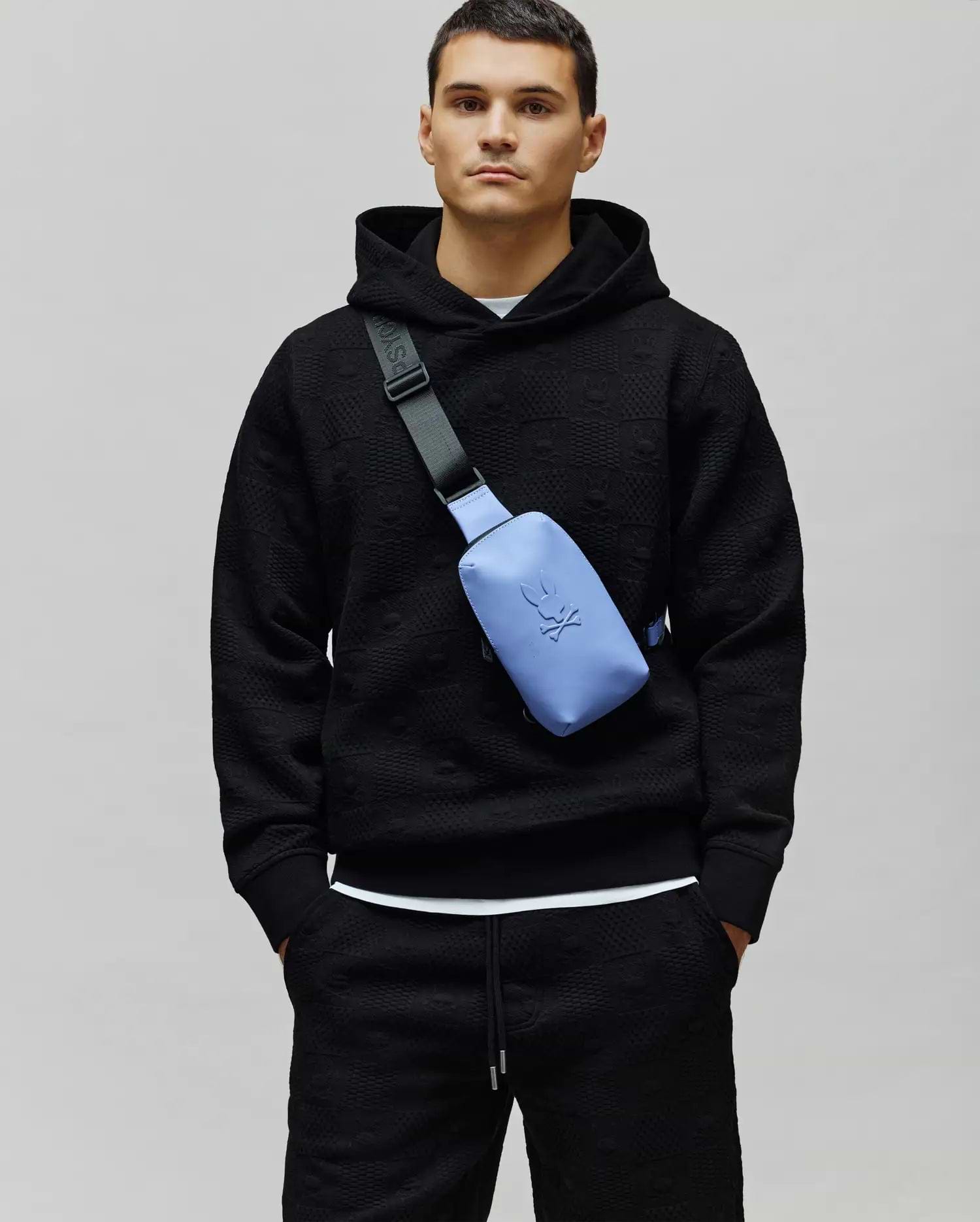 Mens Dustin Hoodie, black premium textured knit with an all-over embossed Psycho Bunny skull logo pattern, featuring a classic fit, drawstring hood, and ribbed cuffs. (1)