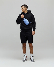 Mens Dustin Hoodie, a black relaxed-fit textured knit hoodie featuring an allover embossed pattern, drawstring hood, and a small embroidered Psycho Bunny skull logo on the left chest. (4)
