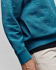 Teal Mens Dustin Hoodie featuring a unique all-over embossed texture with alternating squares of raised dots and subtle Psycho Bunny skull logos, classic fit, ribbed cuffs, and a front kangaroo pocket.