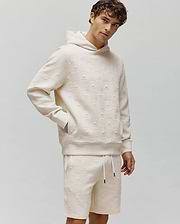 Cream Mens Dustin Hoodie and matching shorts in a relaxed fit, featuring an all-over embossed Psycho Bunny skull and checkerboard textured knit pattern.