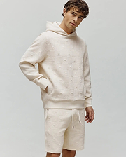 Cream Mens Dustin Hoodie and matching shorts in a relaxed fit, featuring an all-over embossed Psycho Bunny skull and checkerboard textured knit pattern.